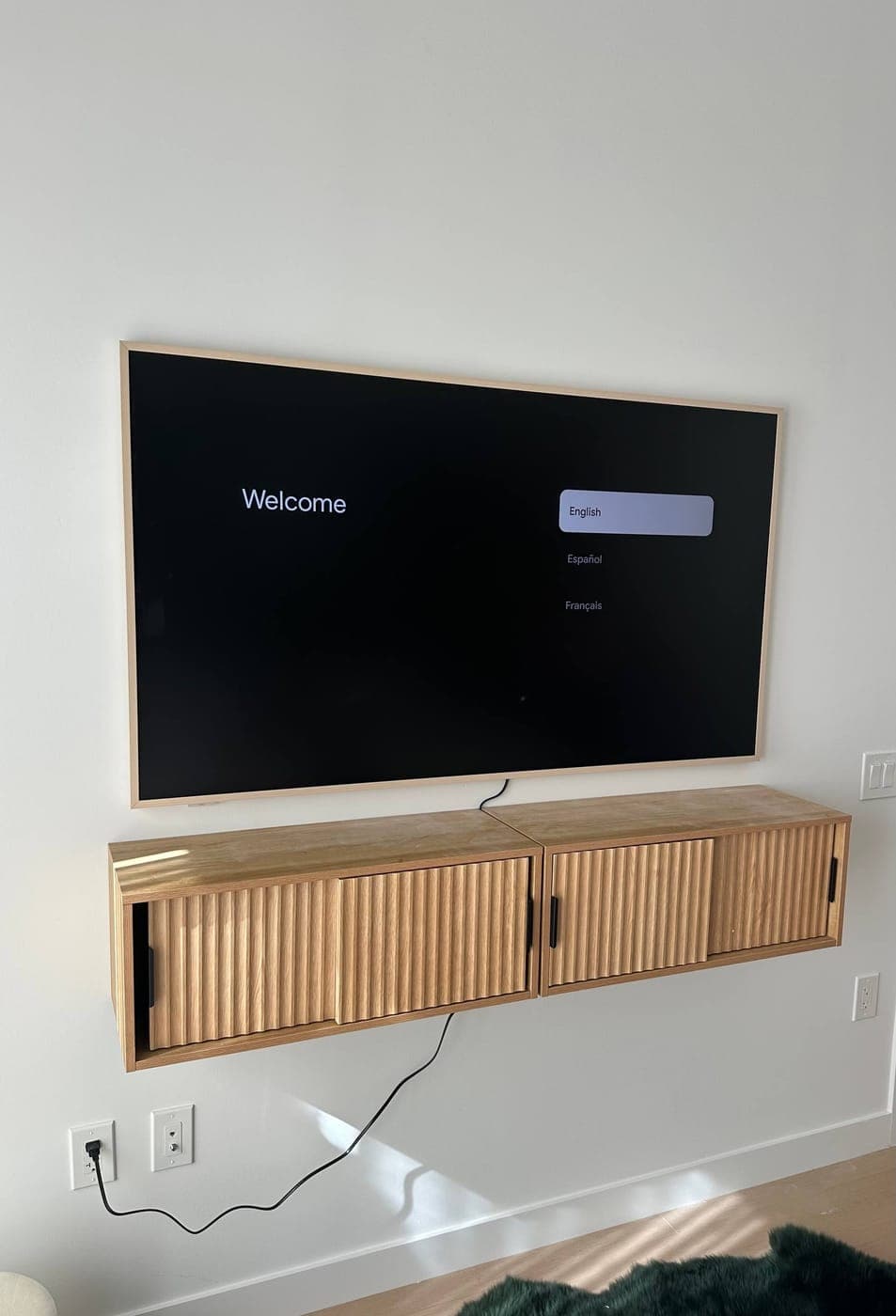 Floating TV installation with wall cabinets in Manhattan